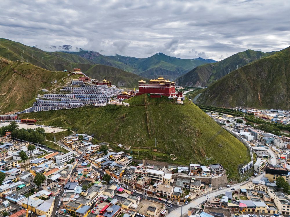 Jiegu Monastery sits atop a hill overlooking Yushu town with surrounding mountains, Qinghai Province, Kham Tibet.