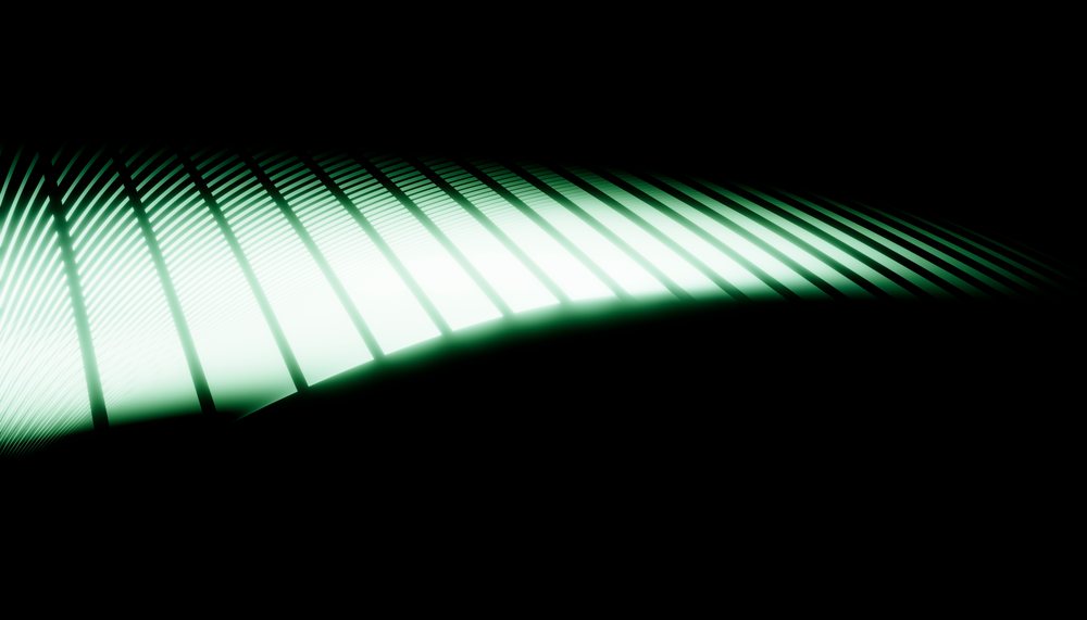 Abstract pattern of curved green light and shadow on a black background with a glowing effect.