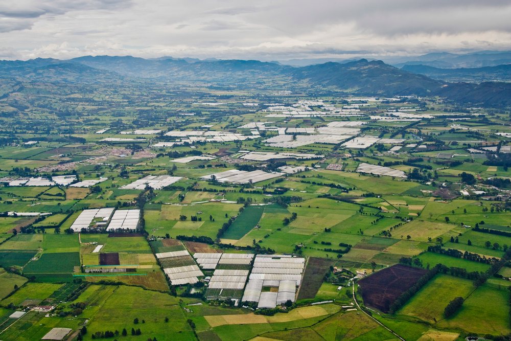 Aerial view of farmland with multiple greenhouses, Near Bogota, Colombia.