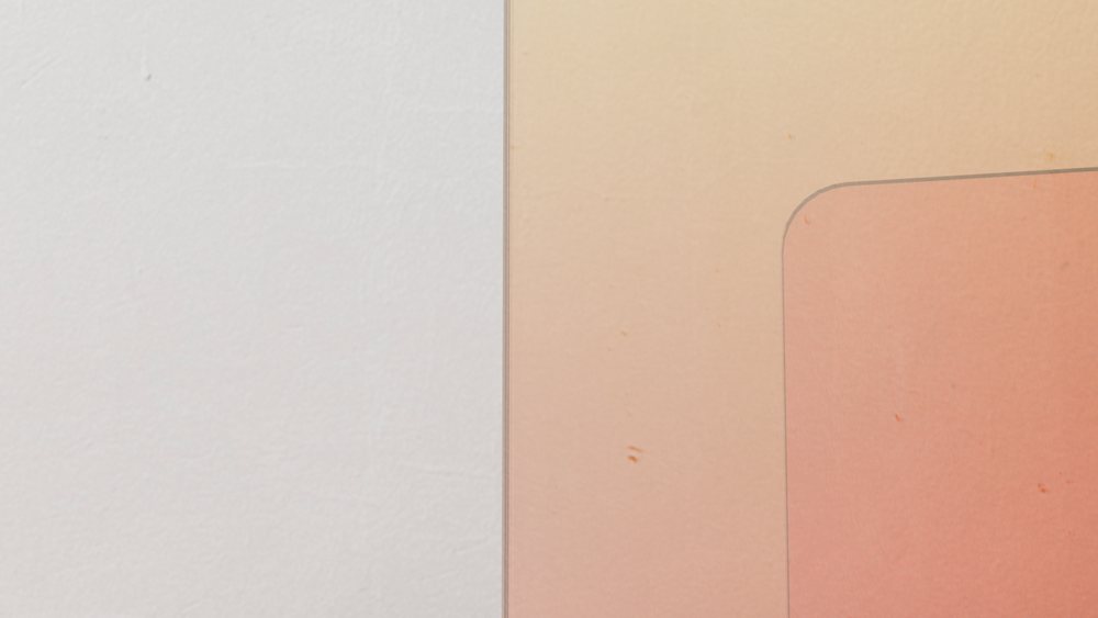 Minimalist wall divided into a white section and a peach colored section with a rounded corner detail.