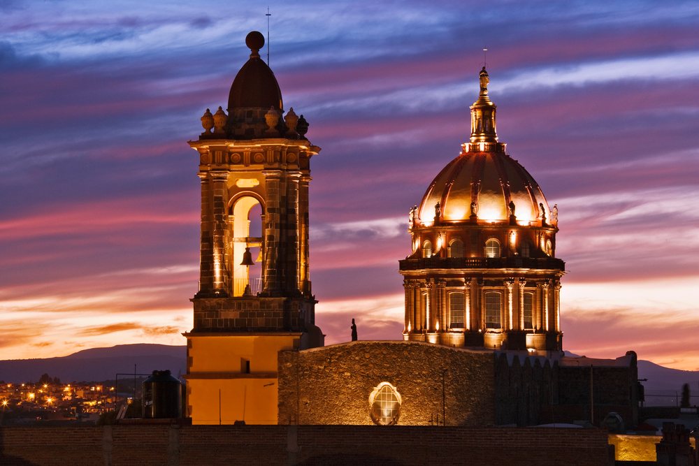 Las Monjas Monastery illuminated, Mexico under a vibrant sky, Dusk, San Miguel.