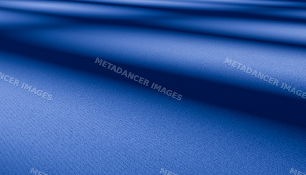 Closeup of soft blue fabric with folds and textured surface