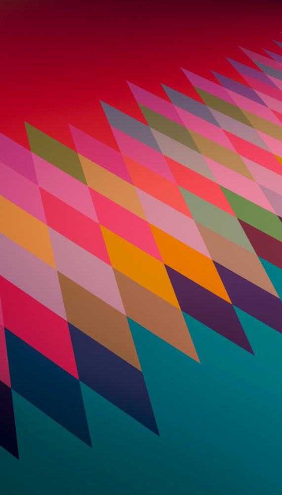 An abstract arrangement of overlapping colorful triangles forming a visually striking geometric pattern.