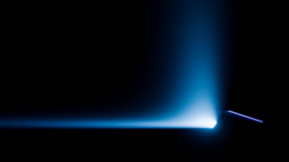 Blue glowing horizontal light beam on dark background with gradient effect creates an abstract visual.