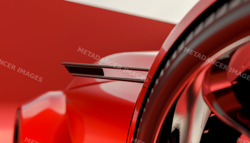 Close-up view of a red sports vehicle with rear wing and wheel detail