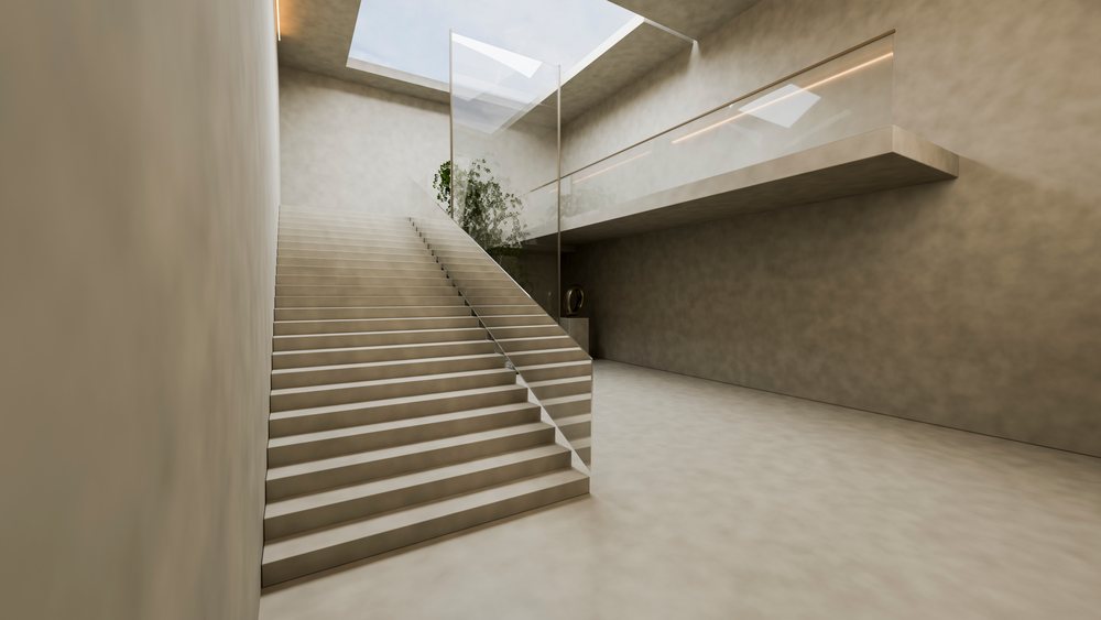 Modern staircase with glass railing illuminated by natural light from a skylight in a bright minimalist indoor space.