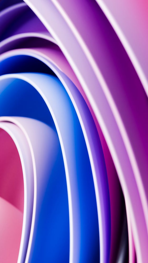 Digital abstract illustration featuring colorful curved shapes in purple, blue, and magenta tones forming a smooth flowing pattern.