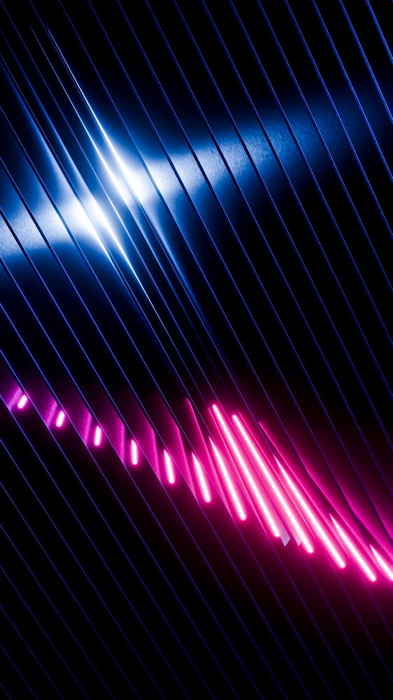 Glowing blue and pink neon lights form a bright abstract pattern on a dark background with reflections on a metallic surface.