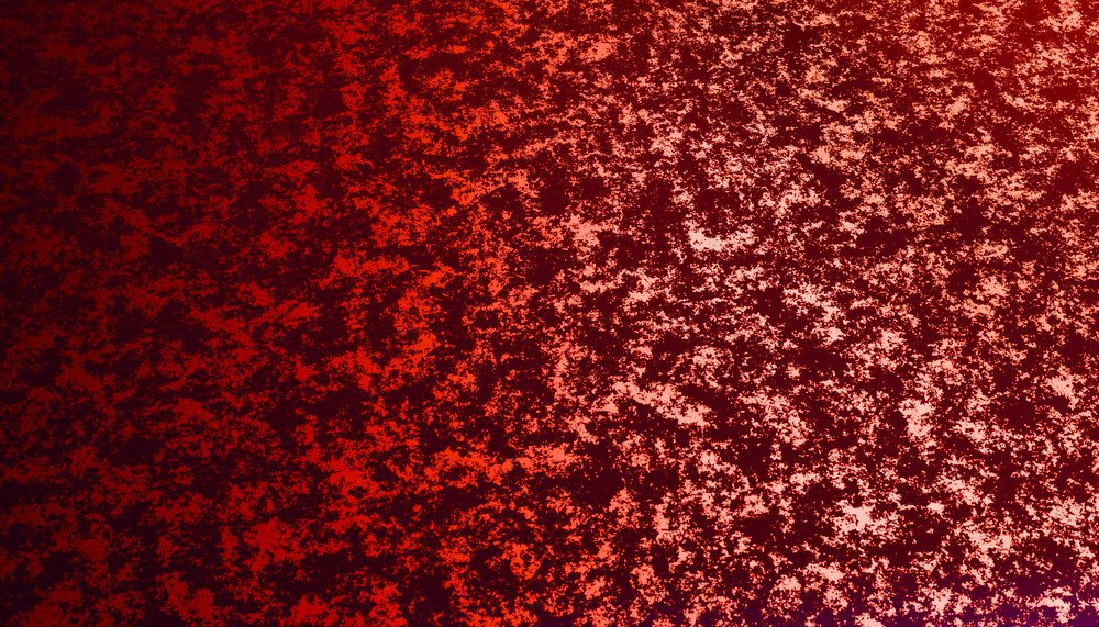 Rust texture on a red metal surface showing corrosion and oxidation pattern.
