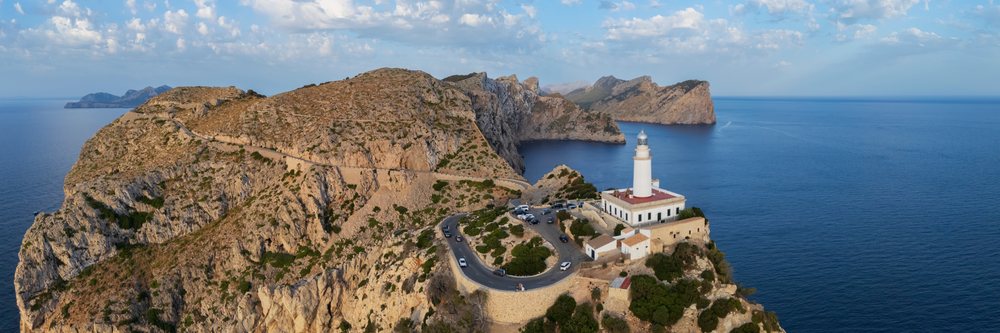 Far de Formentor Lighthouse on rocky cliffs overlooking the Mediterranean Sea at sunrise in Cap de Formentor, Landscape, Lifestyle, Polença, Mallorca, Spain.