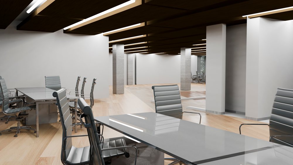 Modern office interior featuring a conference room with gray chairs, glass tables, wood ceiling panels, and light wood flooring.
