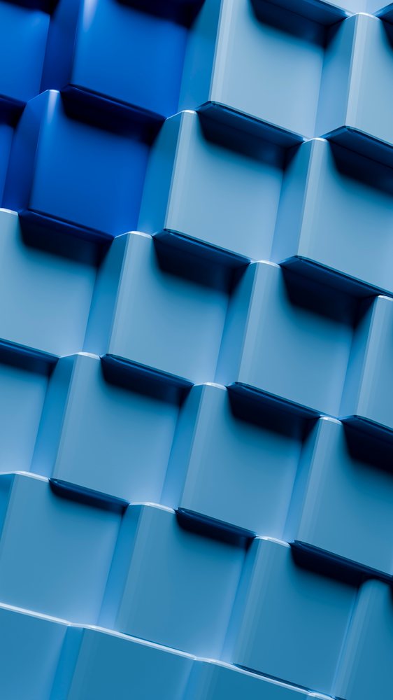 Blue shiny cubical blocks form a 3D layered geometric pattern with a modern abstract design surface.