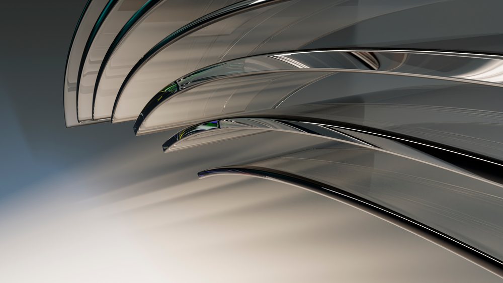 Close-up of multiple modern metal forks with shiny reflective surfaces arranged on a smooth clean surface.