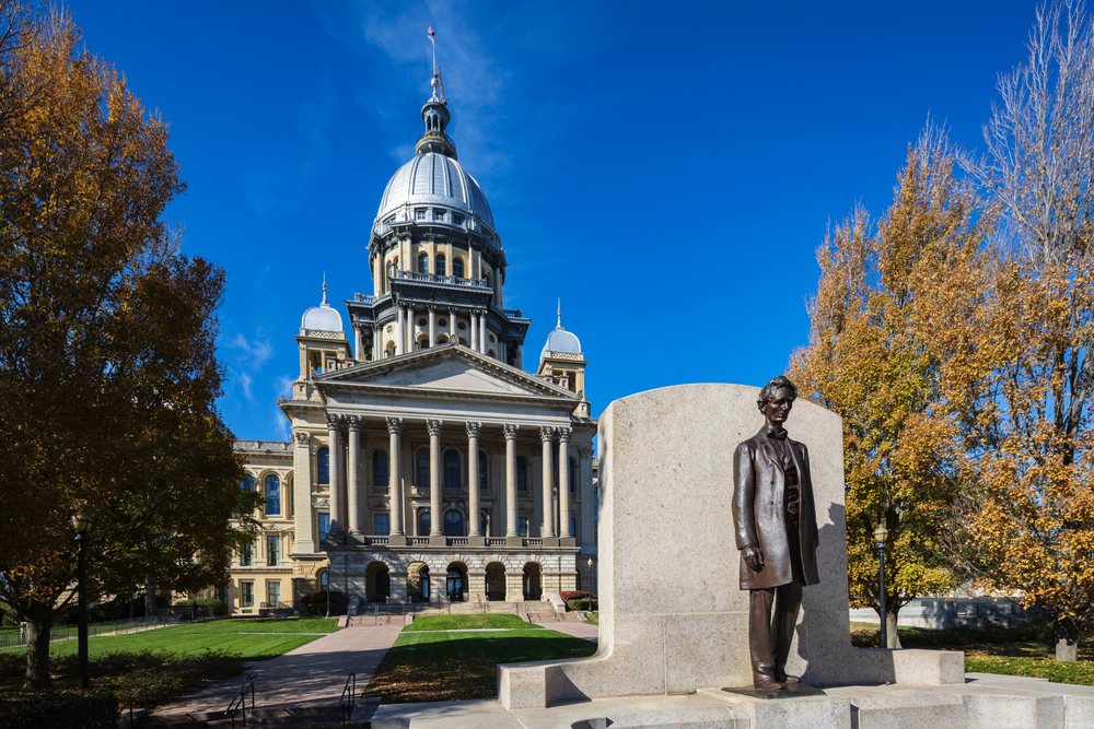 State Capitol Building with a bronze statue and autumn trees under a clear sky, Americana, Historic, Springfield, Missouri, USA.