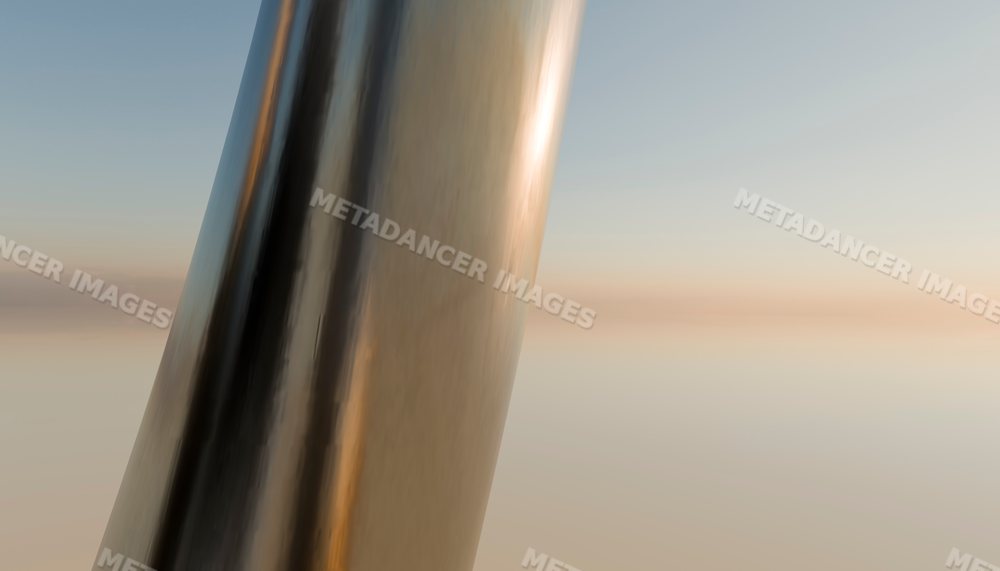 Close-up of a reflective metallic sculpture at sunset