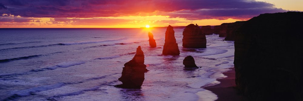 The Twelve Apostles sea stacks rise along the coastline at sunset, Victoria, Twelve Apostles at Sunset Port Campbell National Park Victoria, Australia.