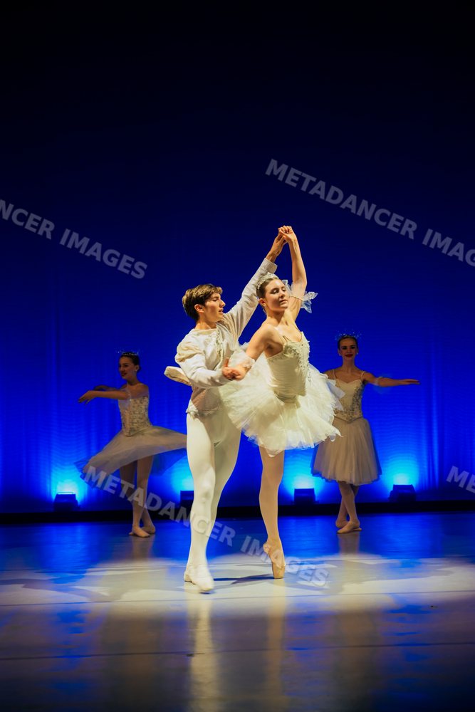 Ballet dancers perform a holiday-themed ballet dance on stage