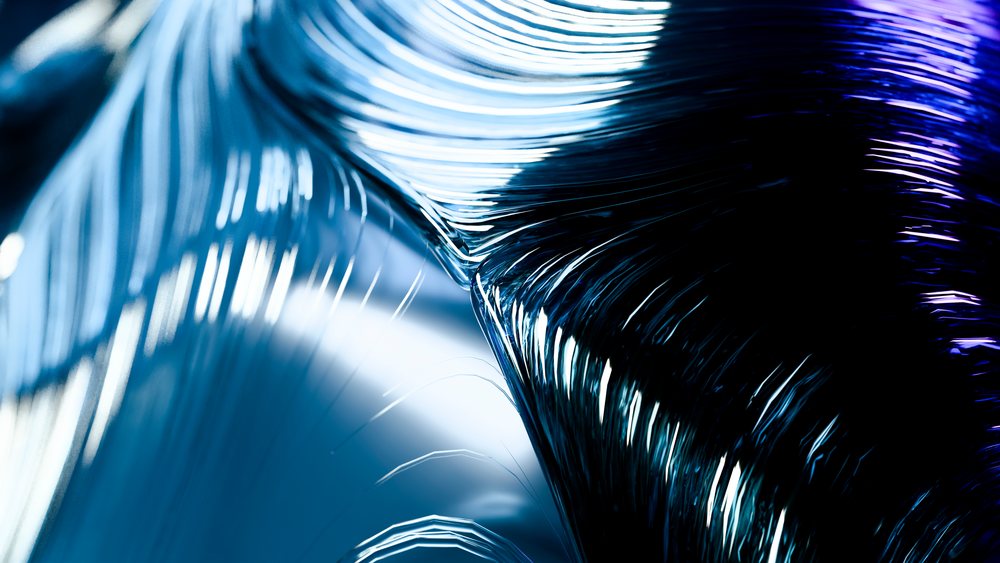 Glossy blue and black curved lines form a flowing wave pattern with reflective light streaks in an abstract digital illustration.