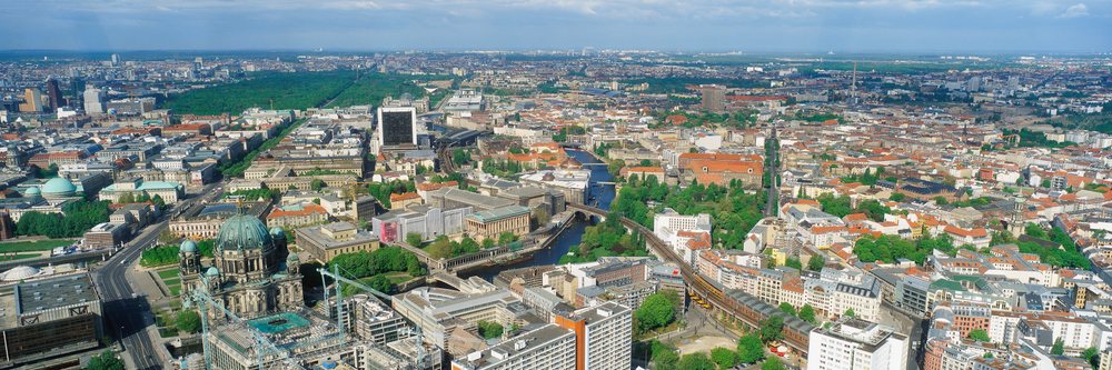Aerial view of Berlin city showing buildings, river with bridges, parks, and urban landscape, Overview Berlin, Germany.