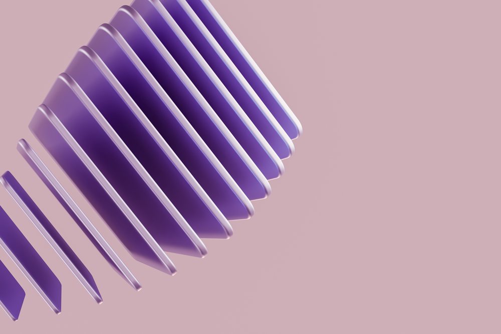 Purple floating abstract shapes with curved edges isolated on a pink background in an abstract render.