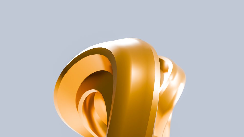 Smooth abstract golden sculpture with curved and looped shapes and a polished reflective surface on a pale blue background.
