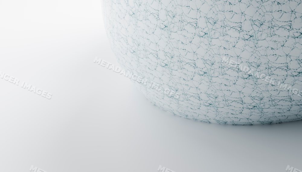 A white sphere with cracked texture on a smooth surface