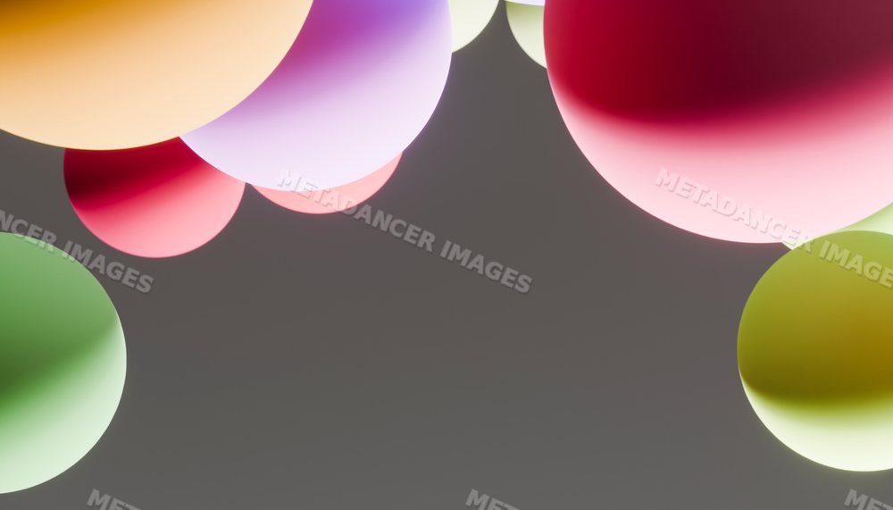 Colorful floating spheres with soft gradient lighting on gray