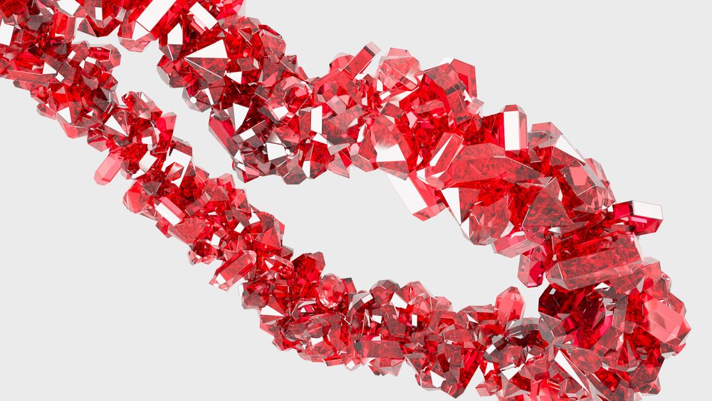 Closeup 3D illustration of a chain formed by transparent red faceted crystals with gemstone shapes on a white background.