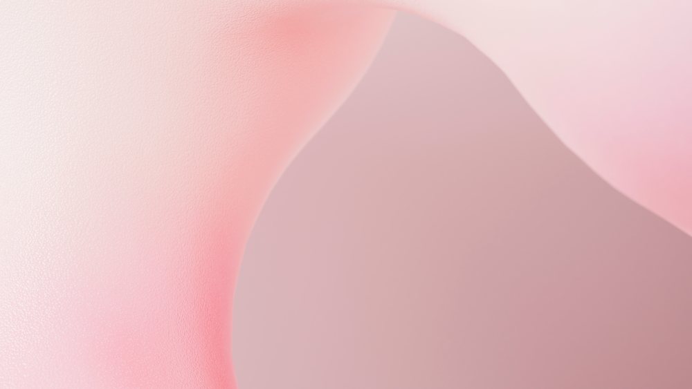 Abstract digital artwork showing smooth, curved pink shapes with a soft textured surface against a pastel background.