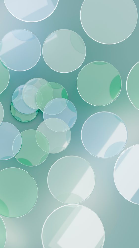 Abstract digital illustration featuring transparent overlapping blue and green circles with smooth textures and light reflections.