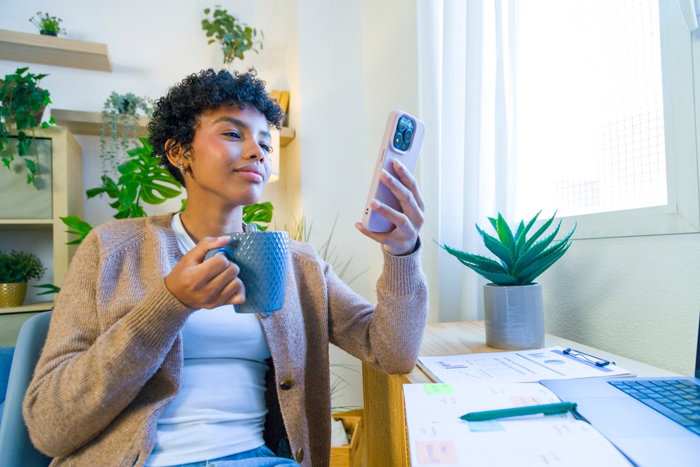 African American woman holding mug looking