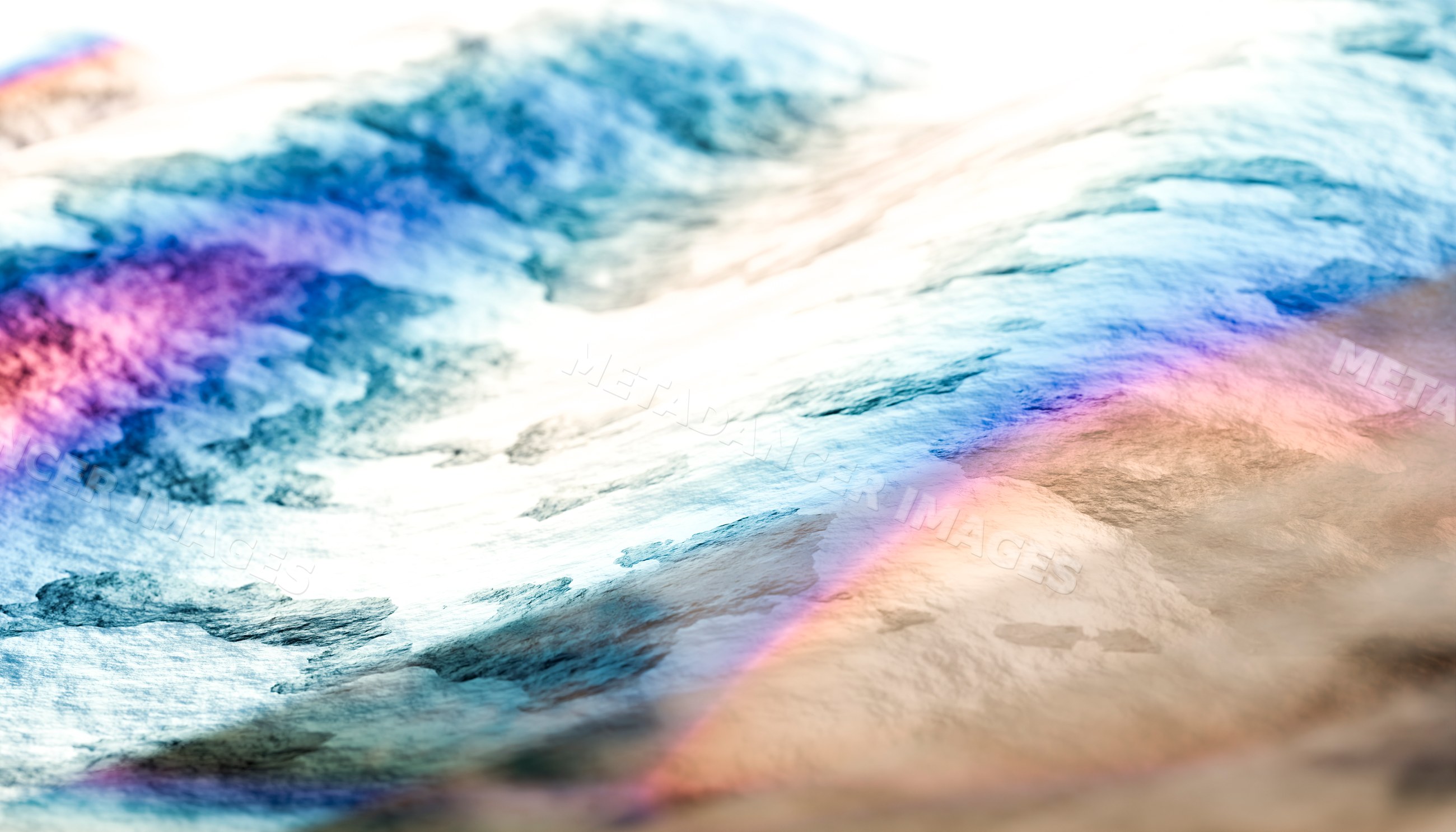 Close-up view of colorful light reflections on a water surface