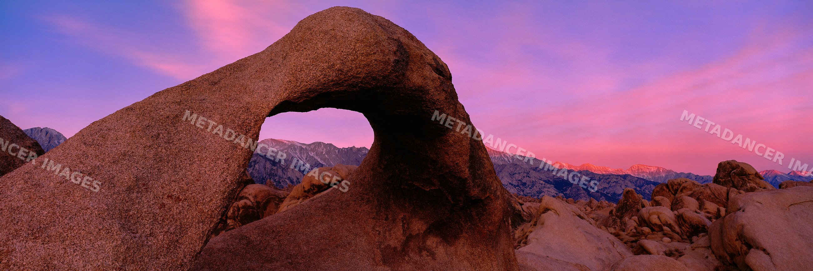 Granite arch rock formation with sierra nevada sunrise