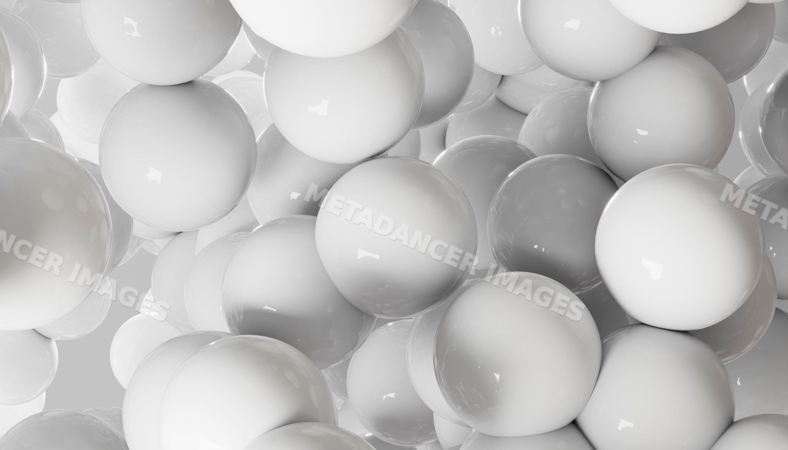A closeup of glossy white spheres clustered in an abstract composition