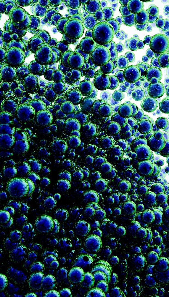 Cluster of blue and green abstract spheres in 3d digital rendering