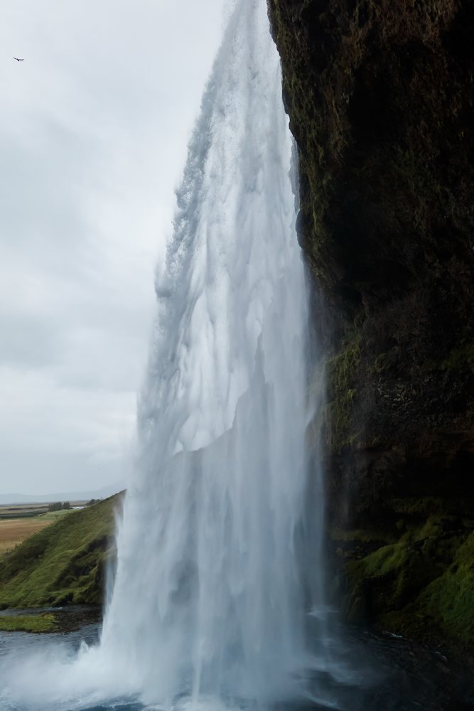 Waterfall cascading powerfully over a cliff