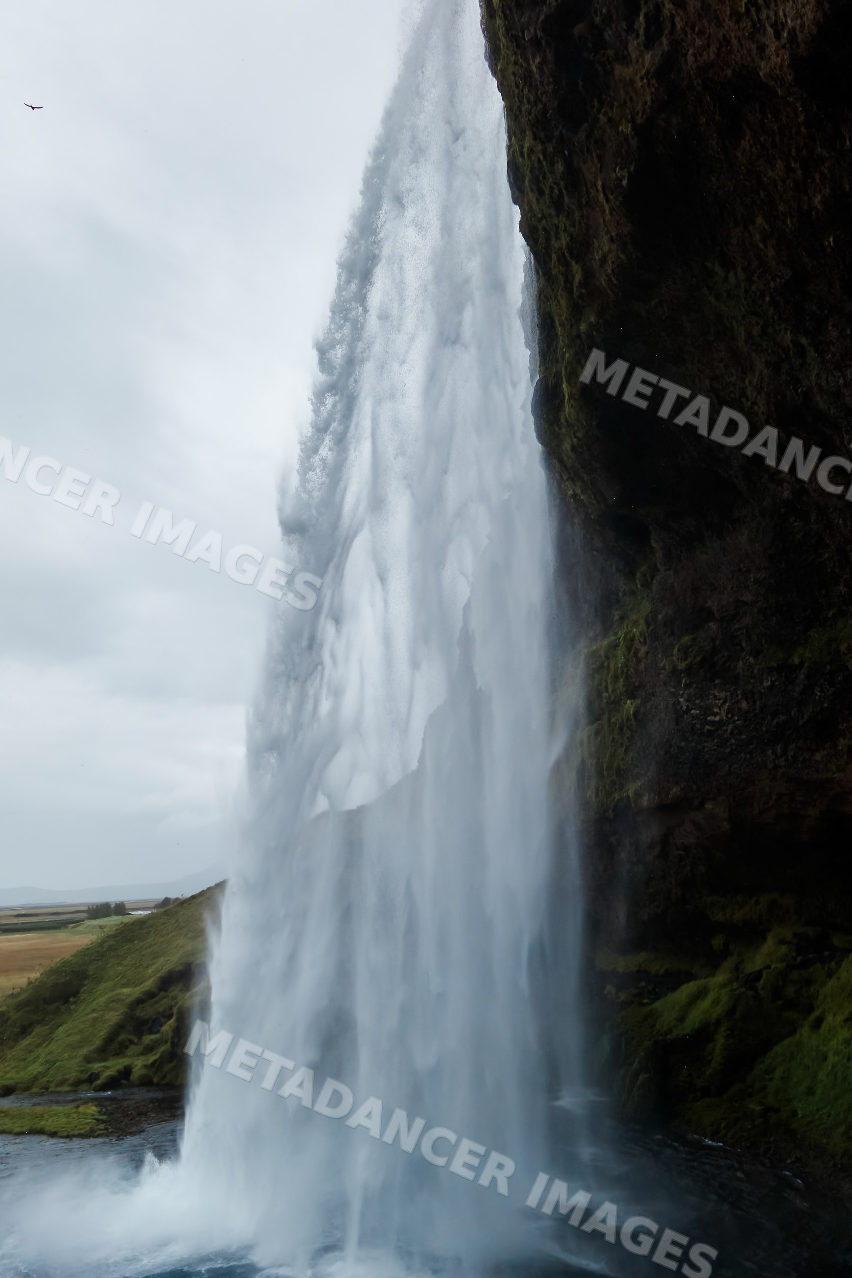 Waterfall cascading powerfully over a cliff