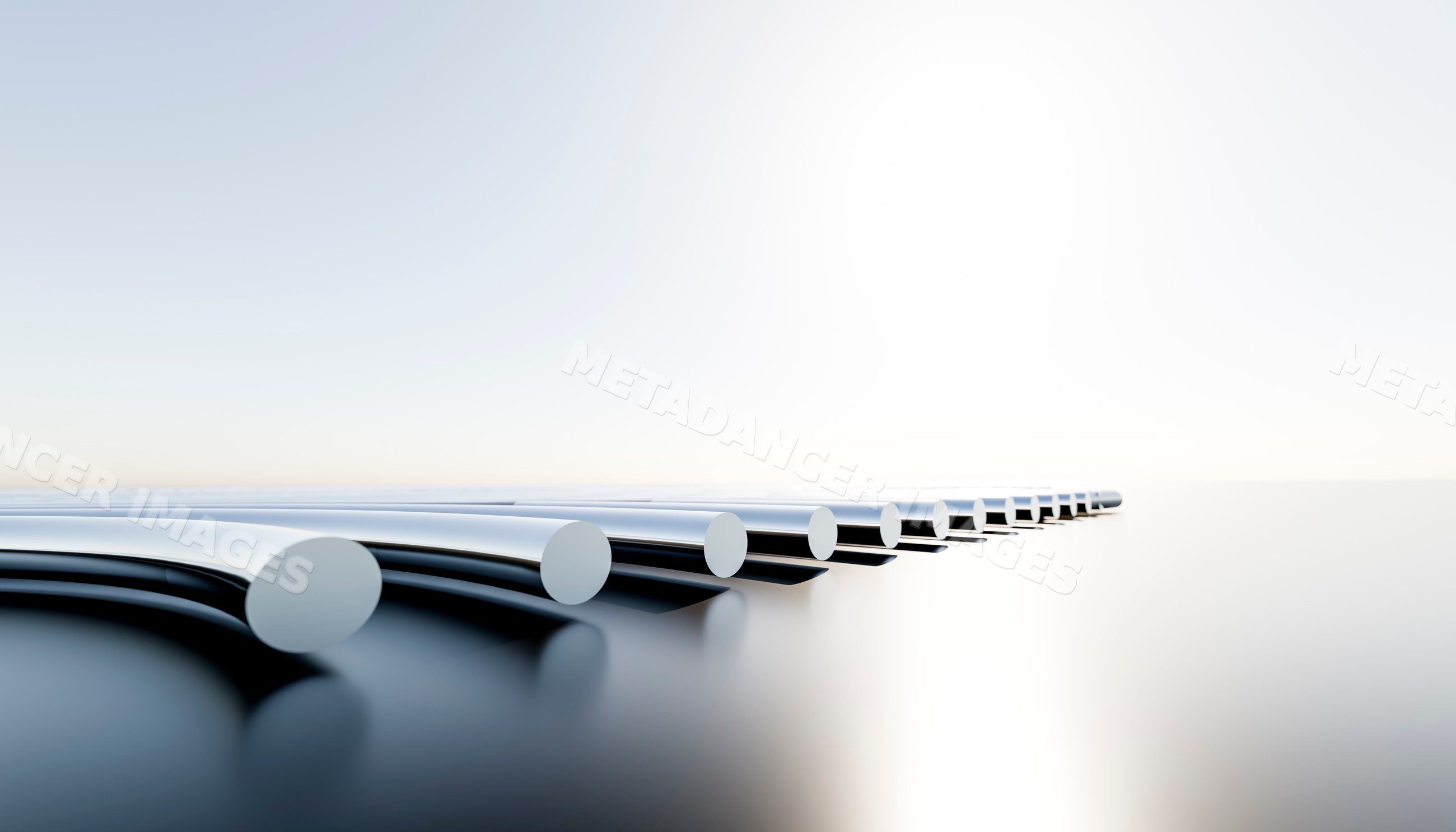 Metal rods with polished chrome ends on reflective surface