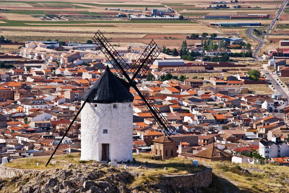 Windmill overlooking town and fields, Spain