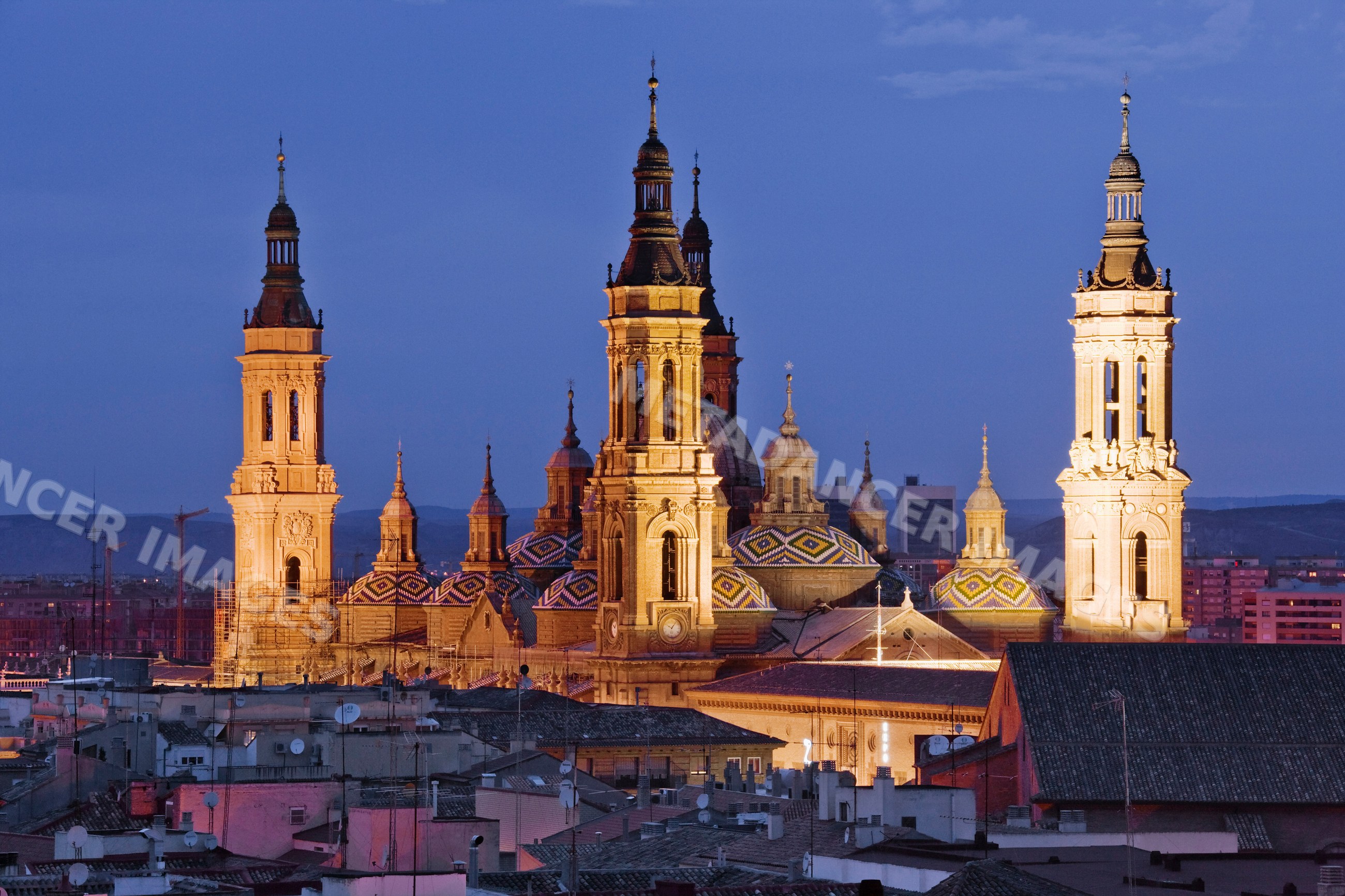 Cathedral of our lady of the pillar illuminated at dusk Spain