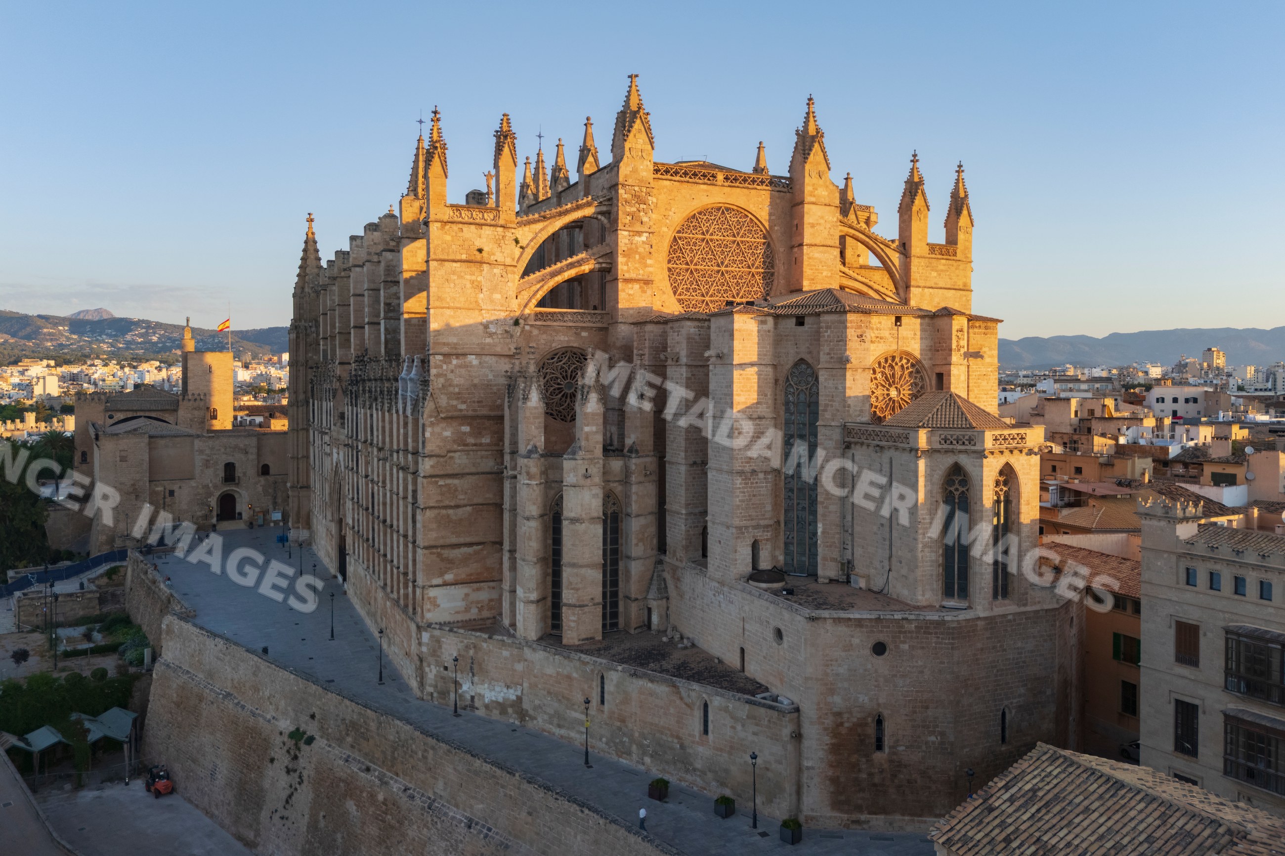 Cathedral in Palma de Mallorca with surrounding cityscape at sunset