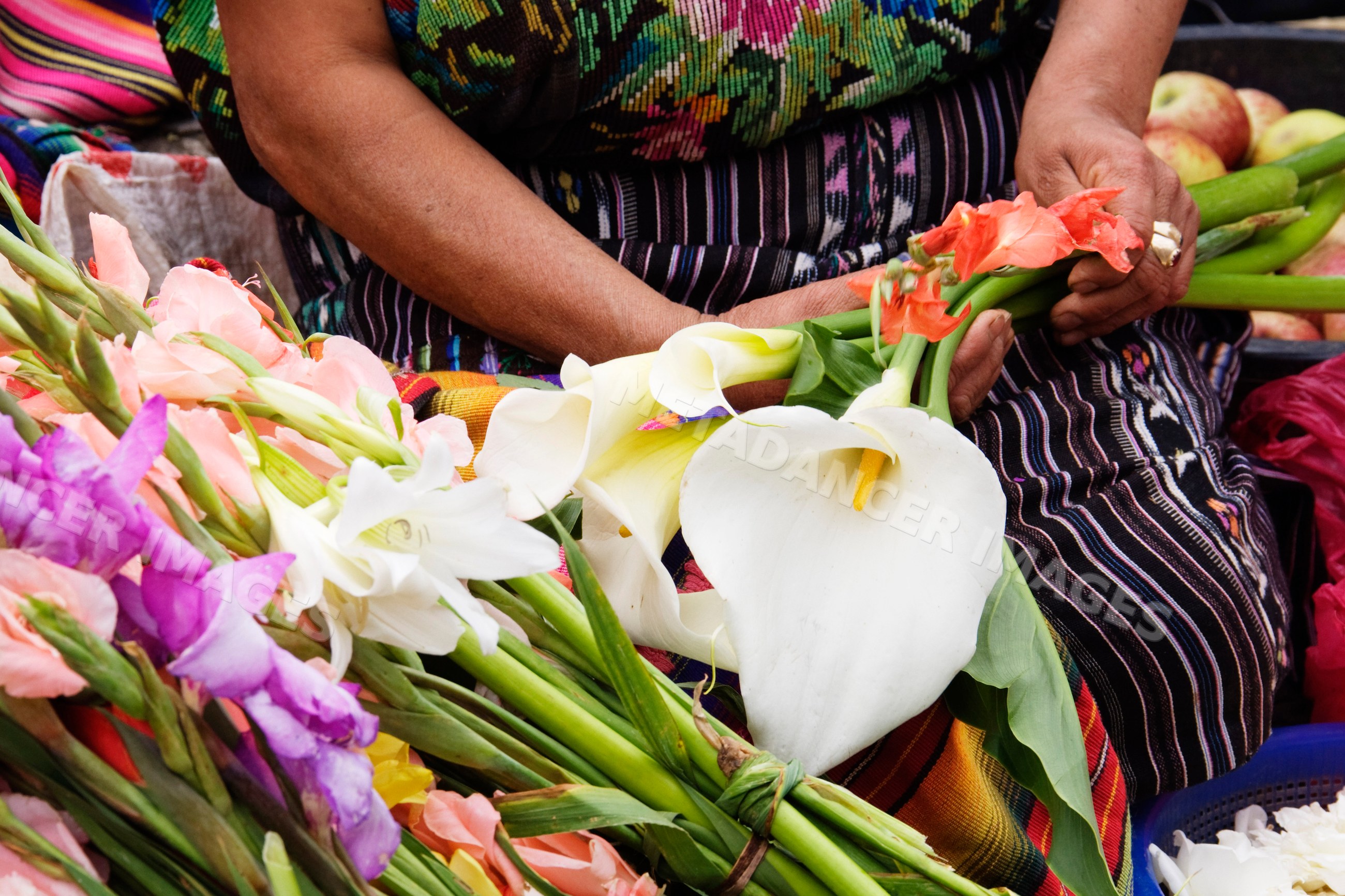 Woman selling flowers guatemala