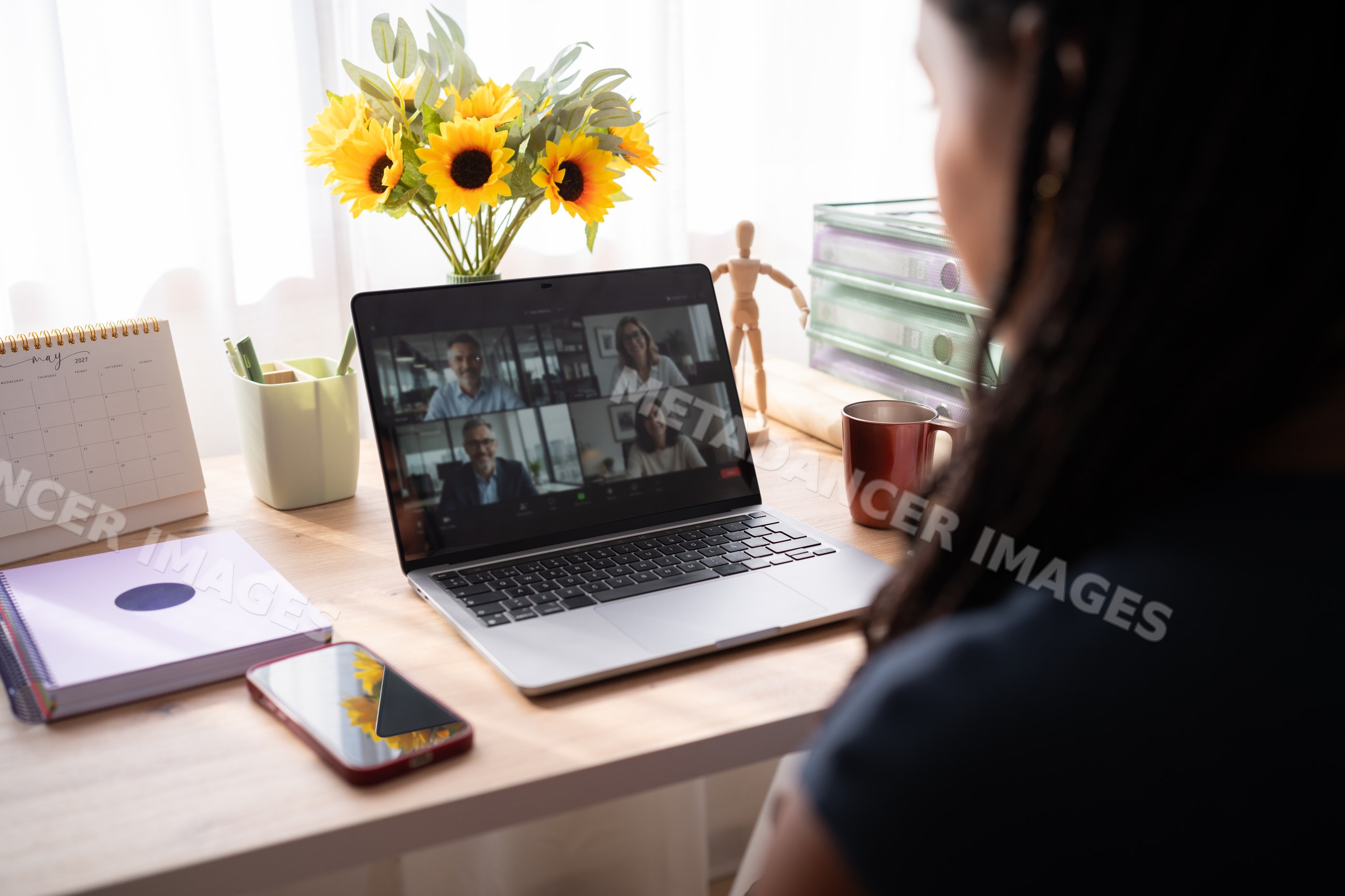 African American woman attends a video conference