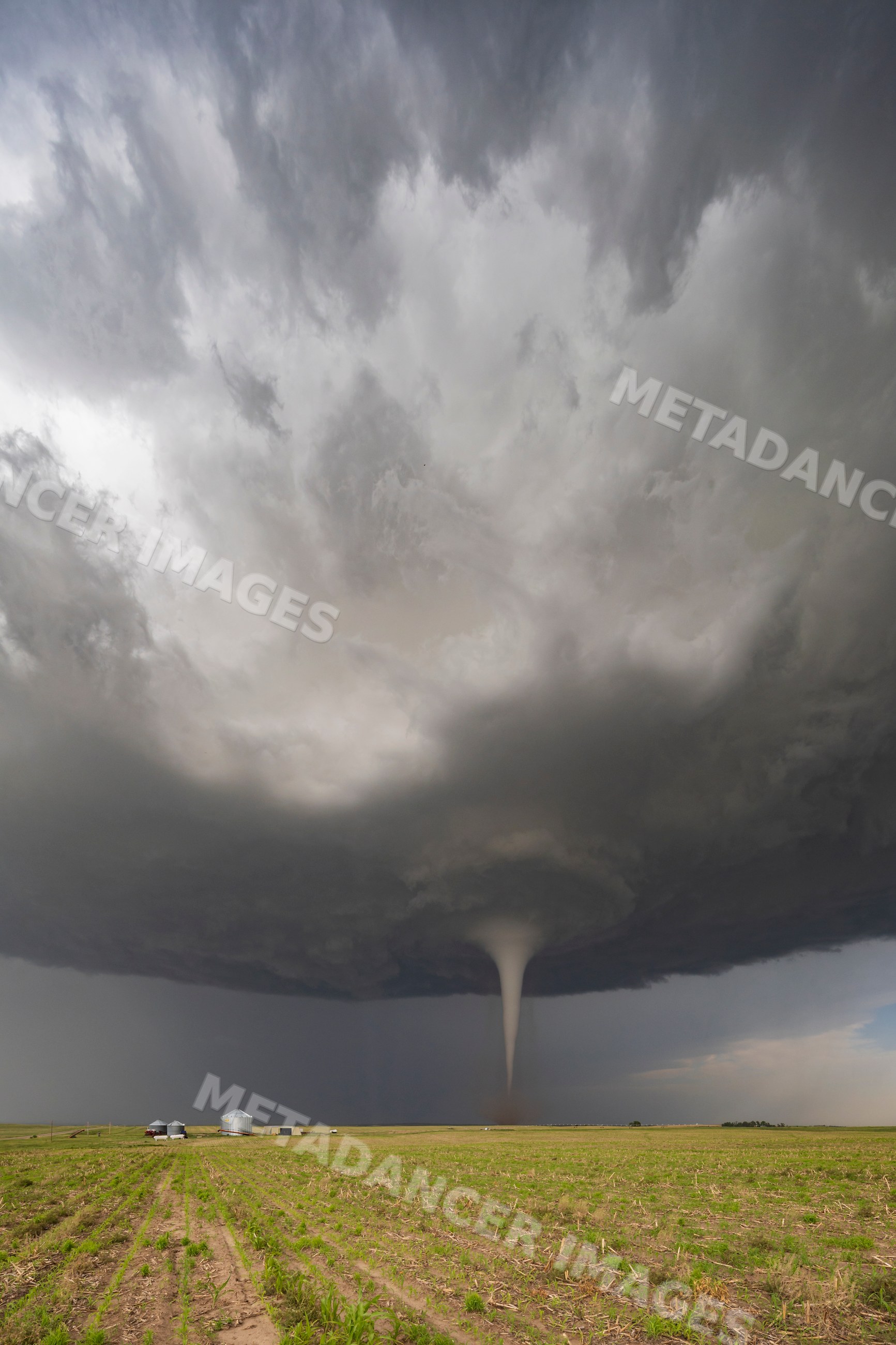 Tornado forming over stormy farm field in dickens, nebraska