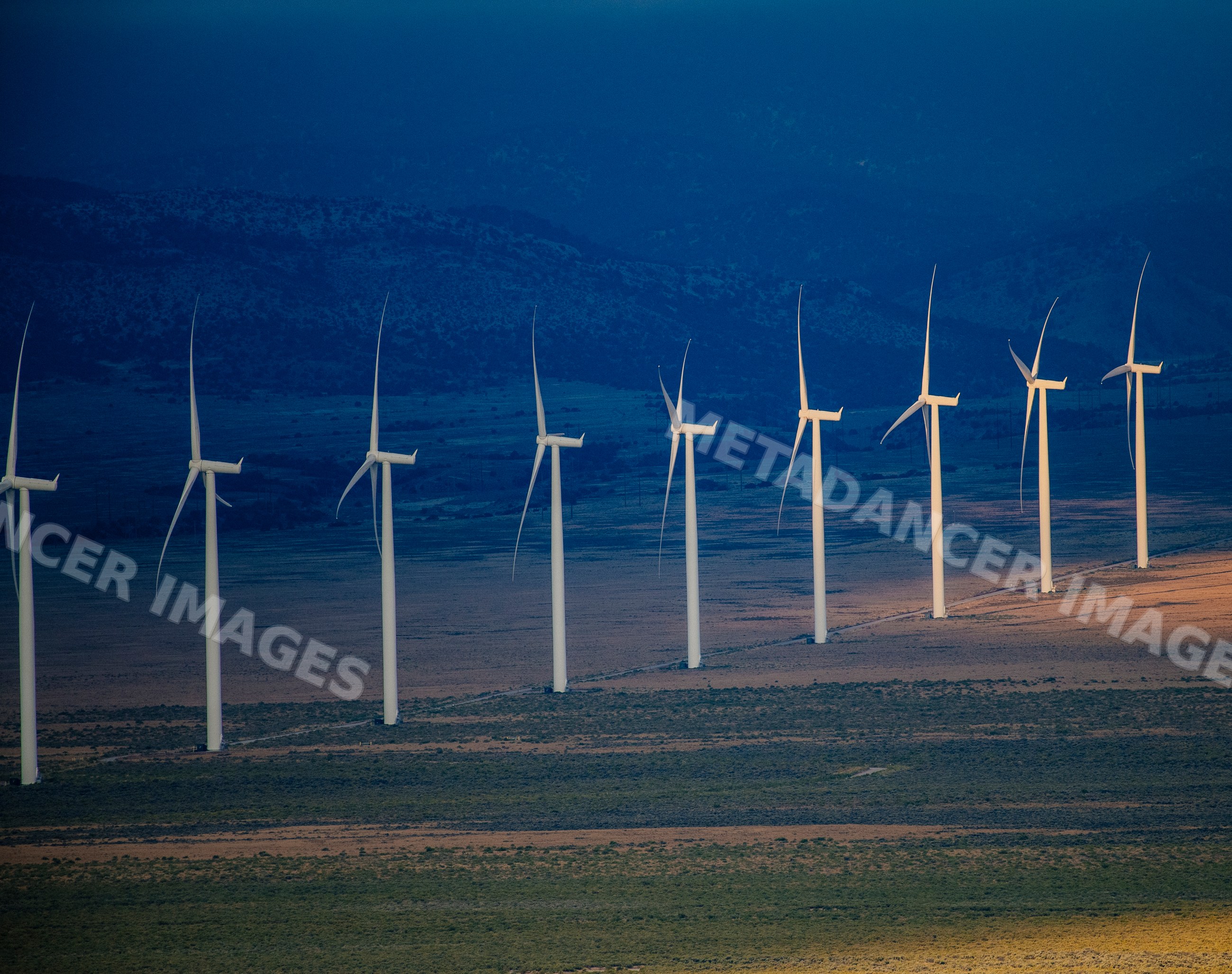 Wind turbines generating energy in Nevada desert landscape