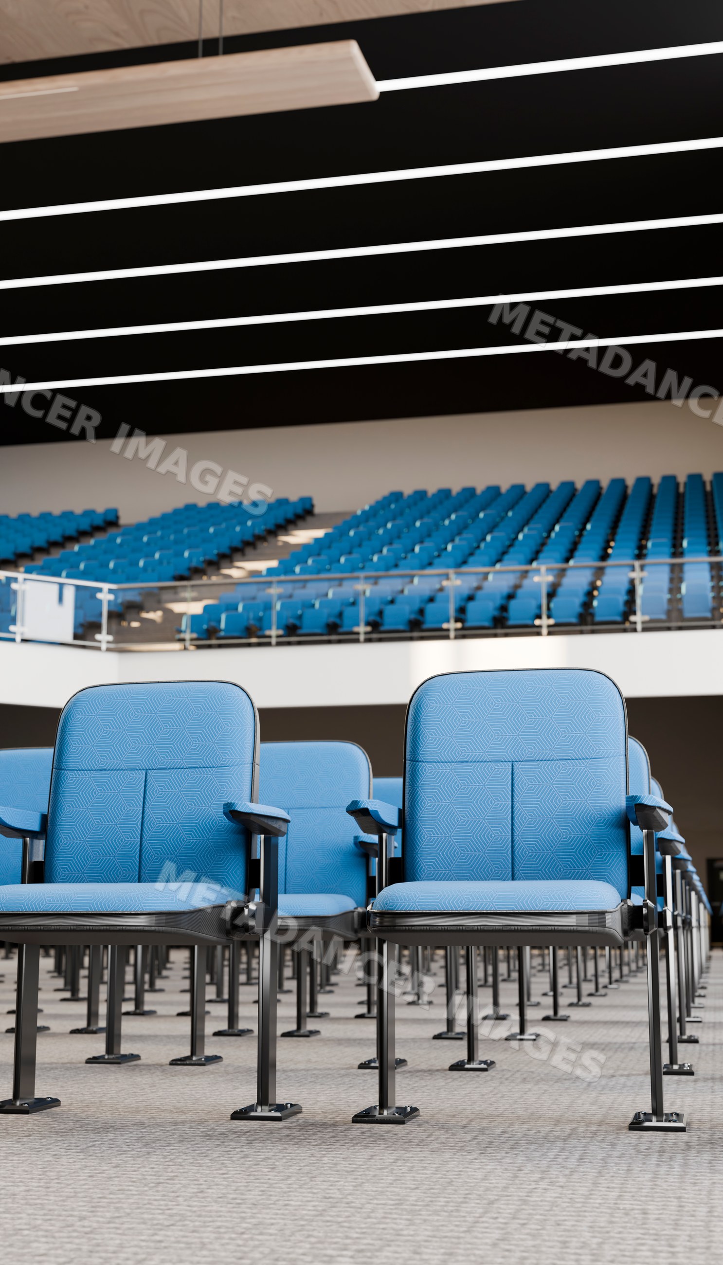 Rows of blue chairs in a spacious modern auditorium
