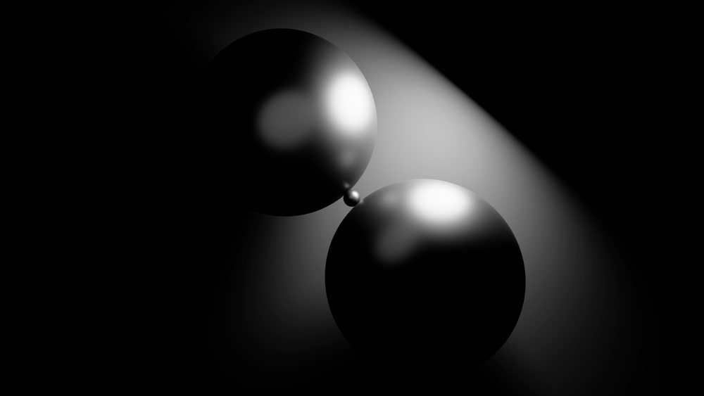 Two glossy black spheres touching with reflective lighting