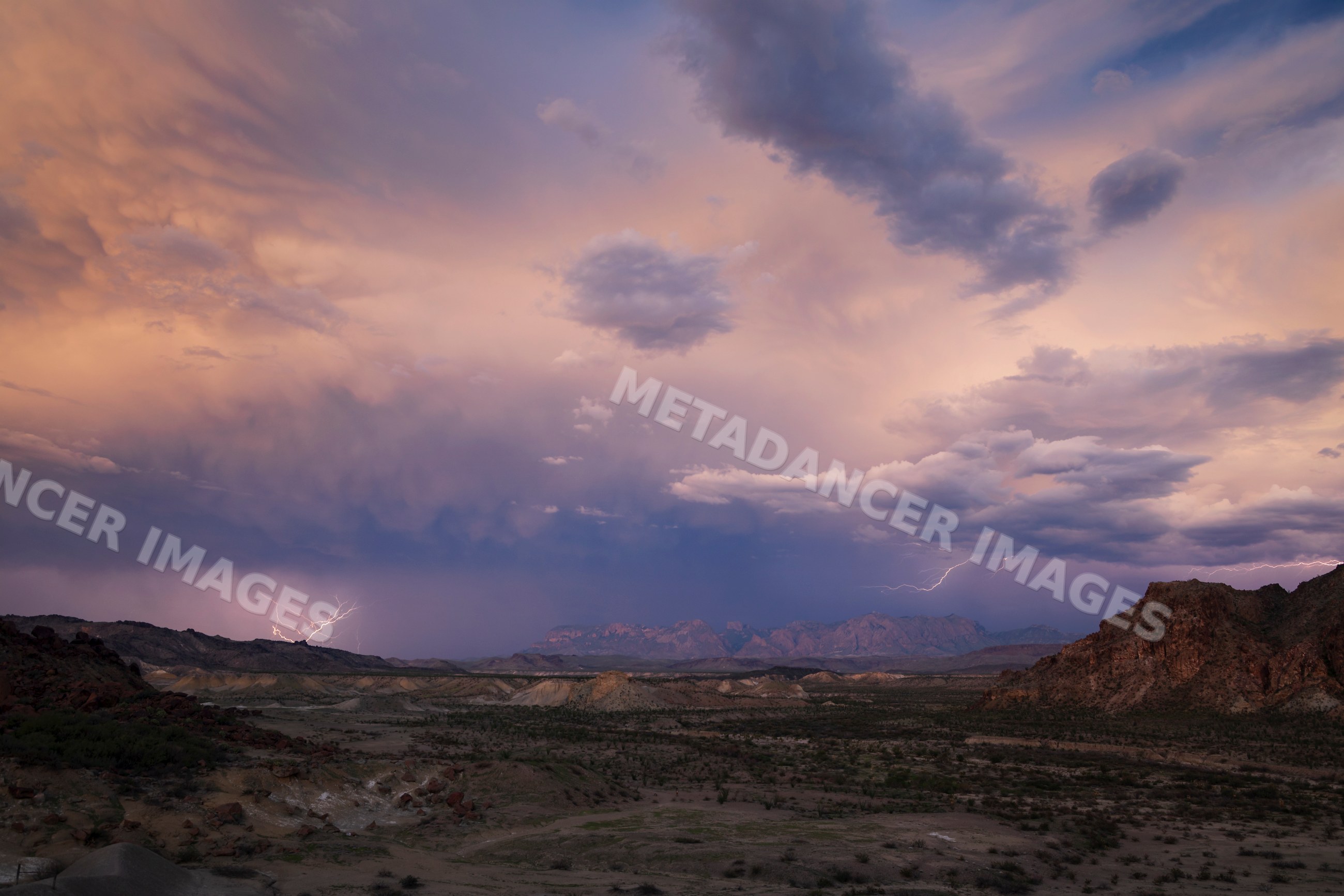 Lightning storm over Chisos Mountains in a park