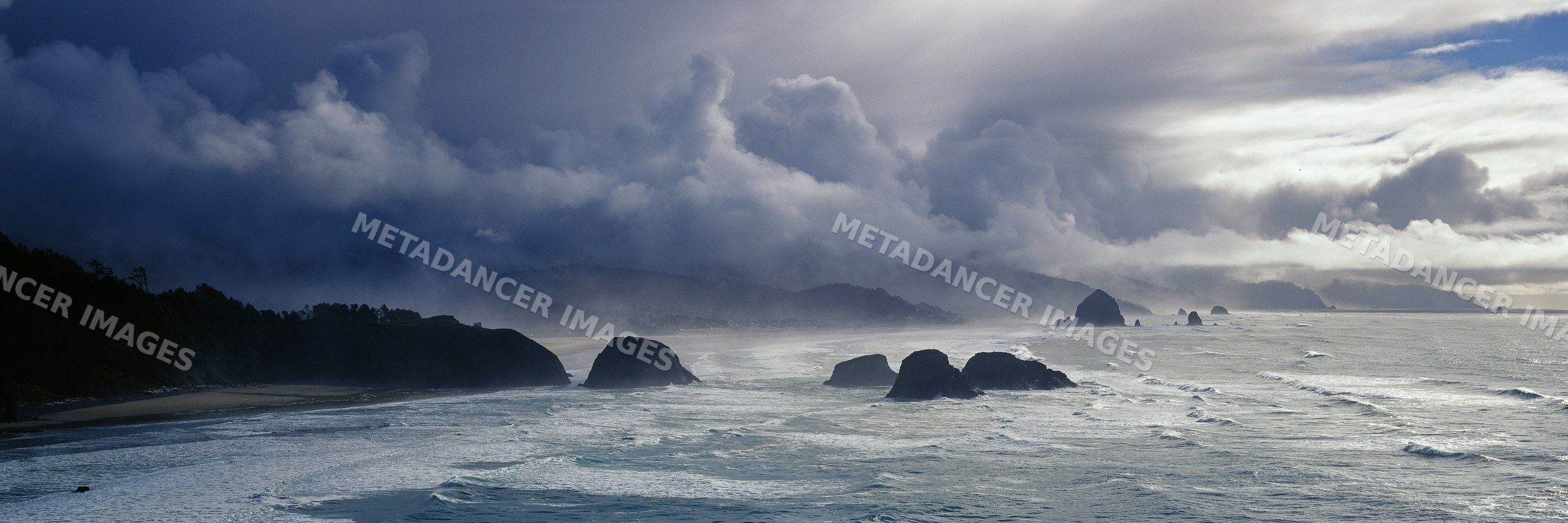 Rocky coastline with mist and waves