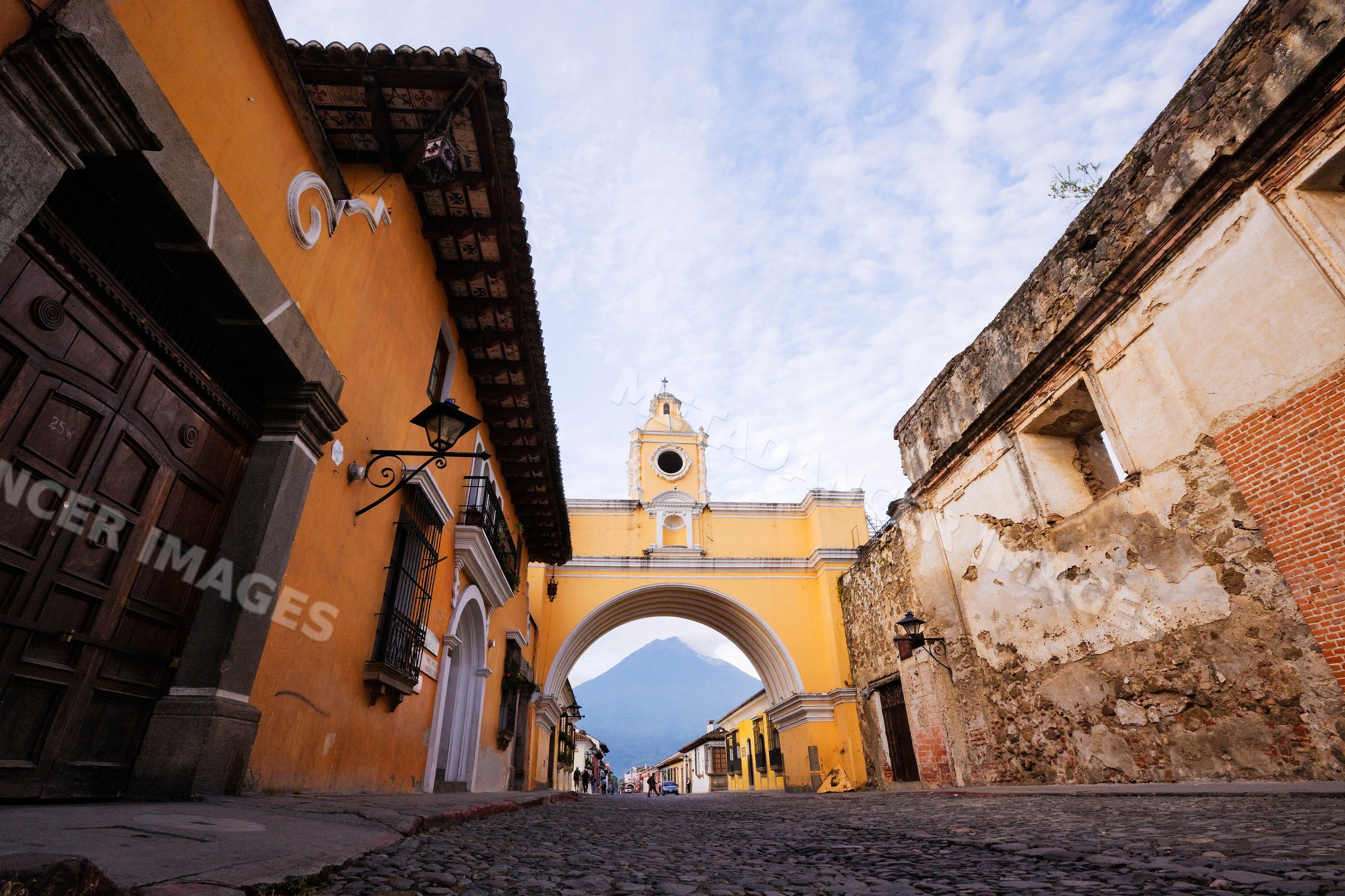 Volcan de agua volcano framed by historic archway in antigua guatemala